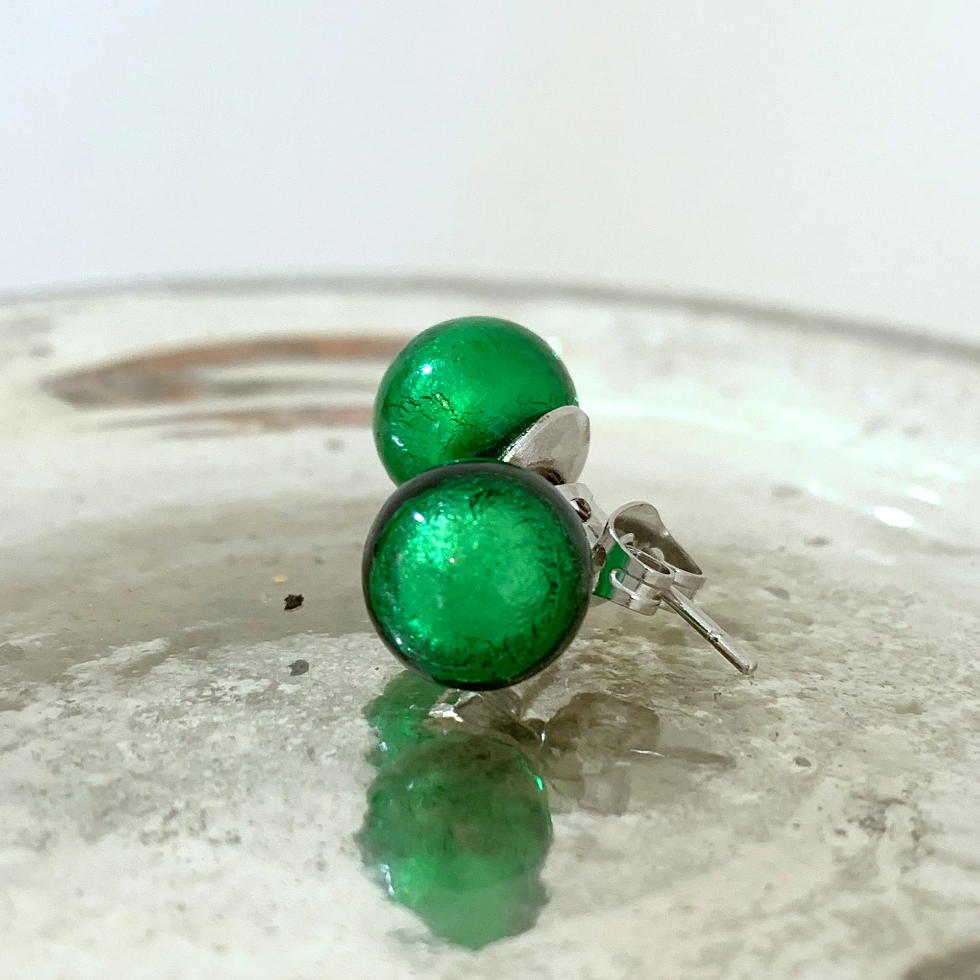 Earrings with dark green (emerald) Murano glass sphere studs on surgical steel posts